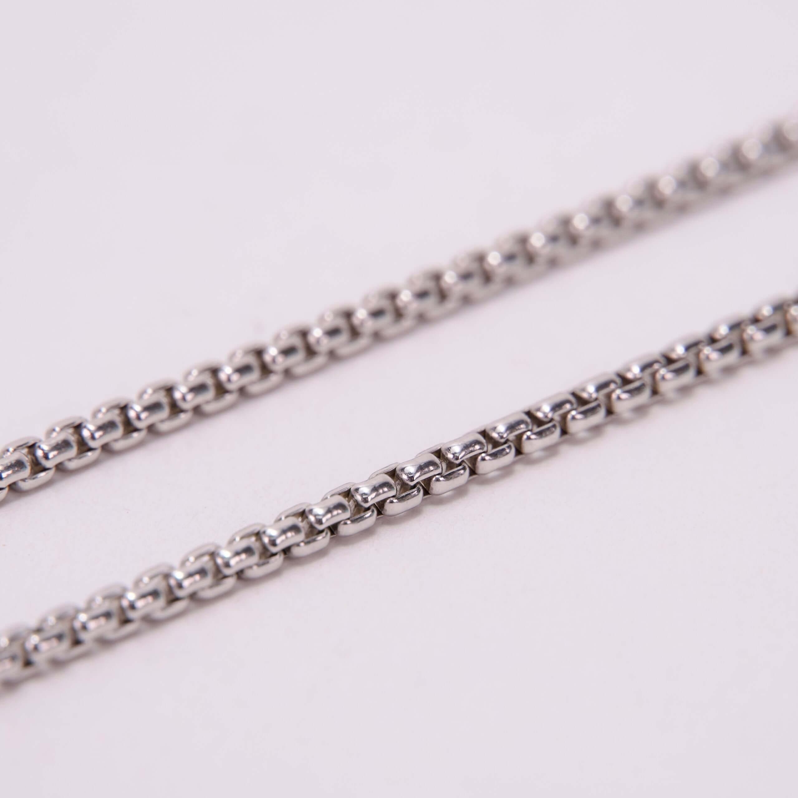 Close-up of silver metal chains.