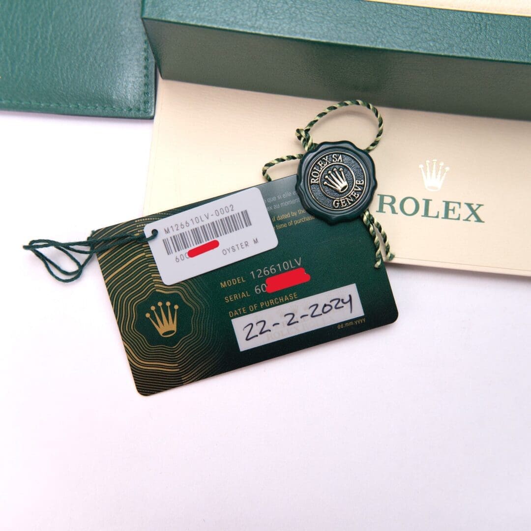 Rolex tag and card with purchase date.
