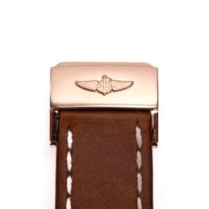 Brown leather watch strap with metal clasp.