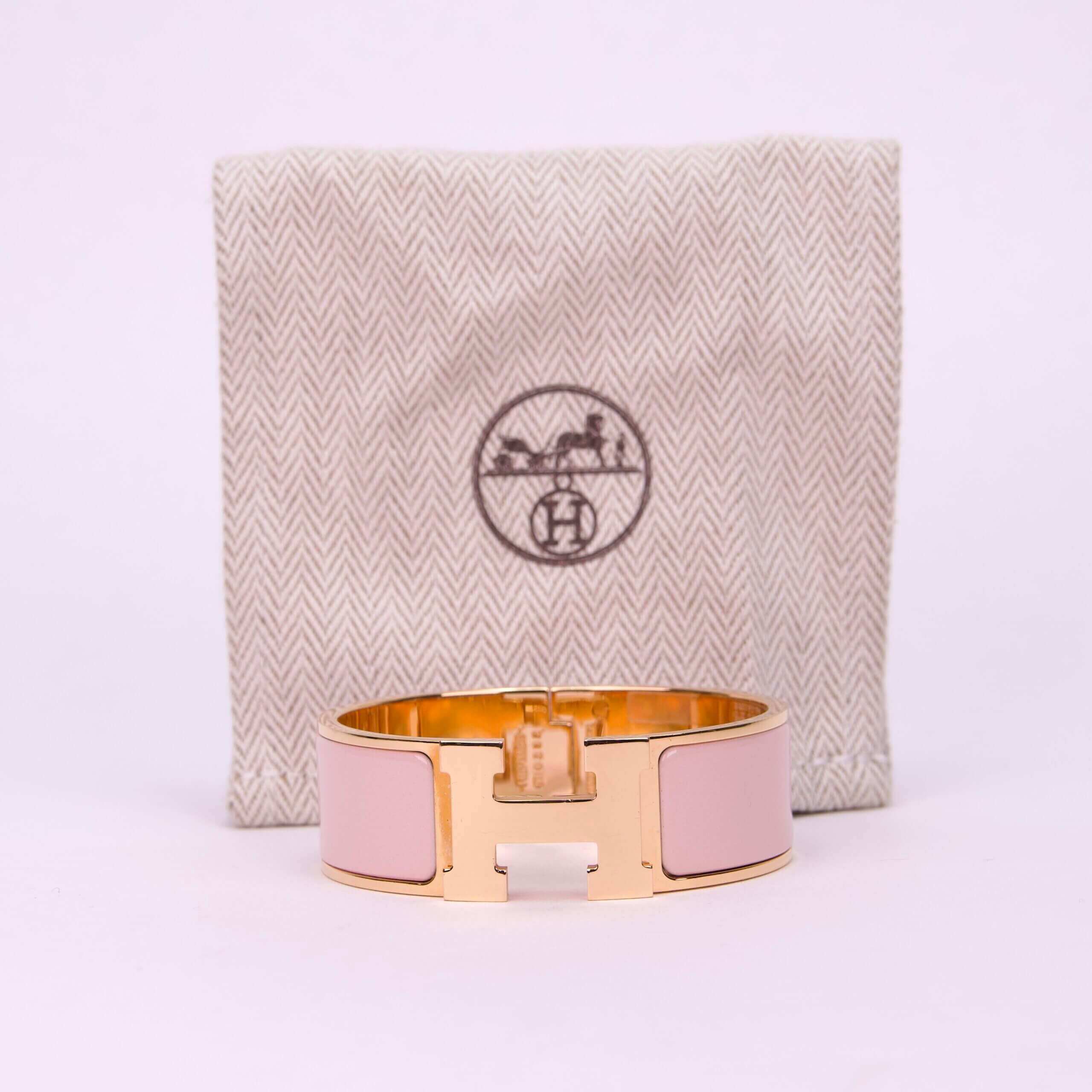 Gold and pink bracelet with pouch.