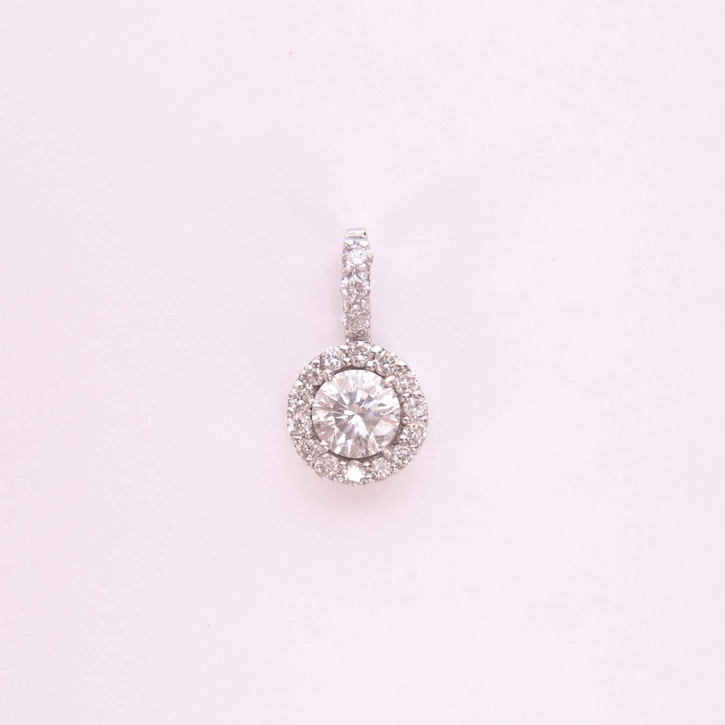 Diamond pendant with a circular halo design.