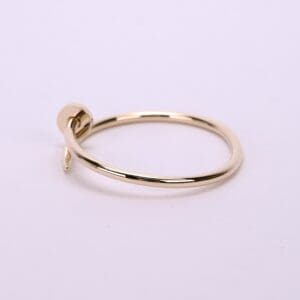 Gold bracelet with a nail design.