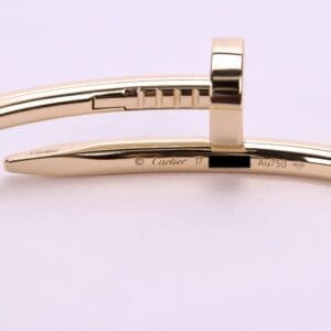Gold Cartier bracelet with engraved details.