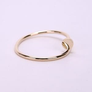 Gold ring with minimalist design.
