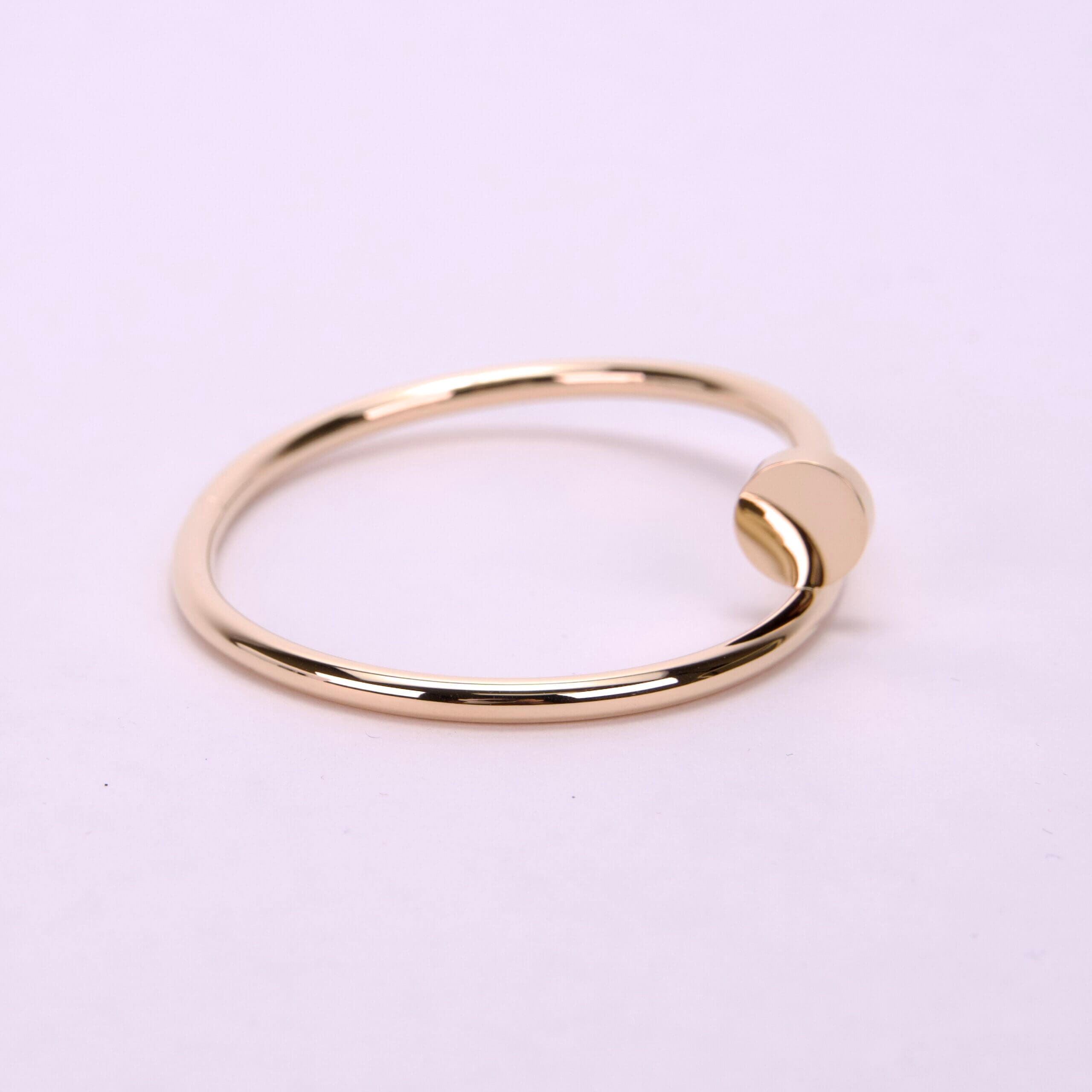 Gold ring with minimalist design.