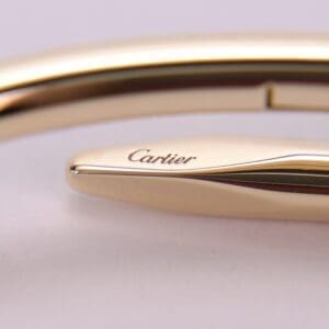 Gold Cartier bracelet with engraved logo.
