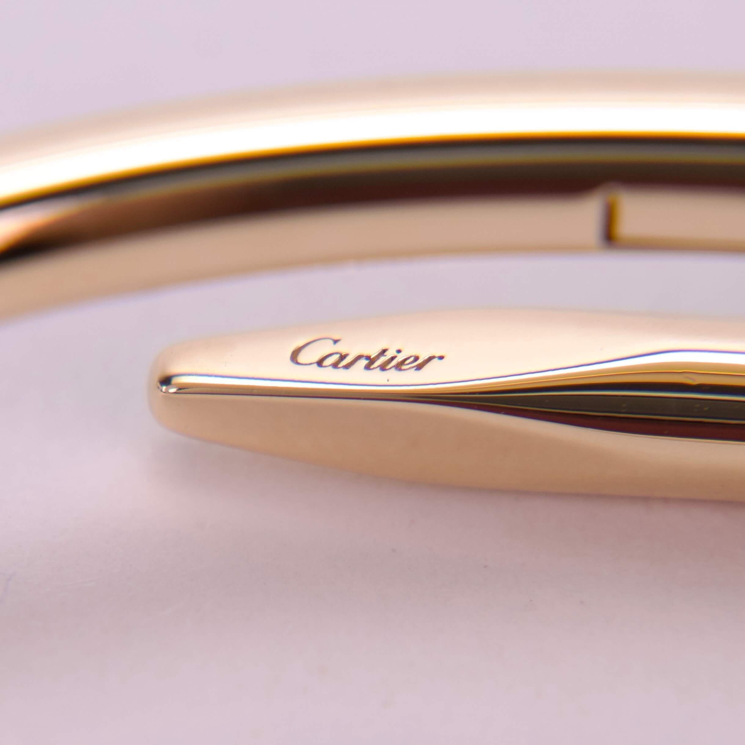 Gold Cartier bracelet with engraved logo.