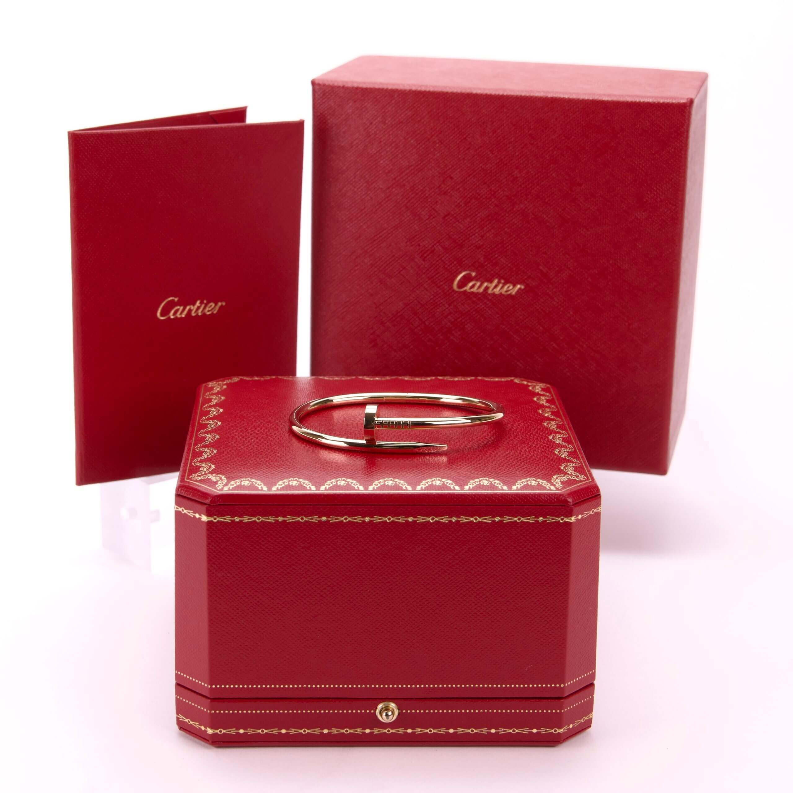 Red Cartier box with bracelet and booklet.