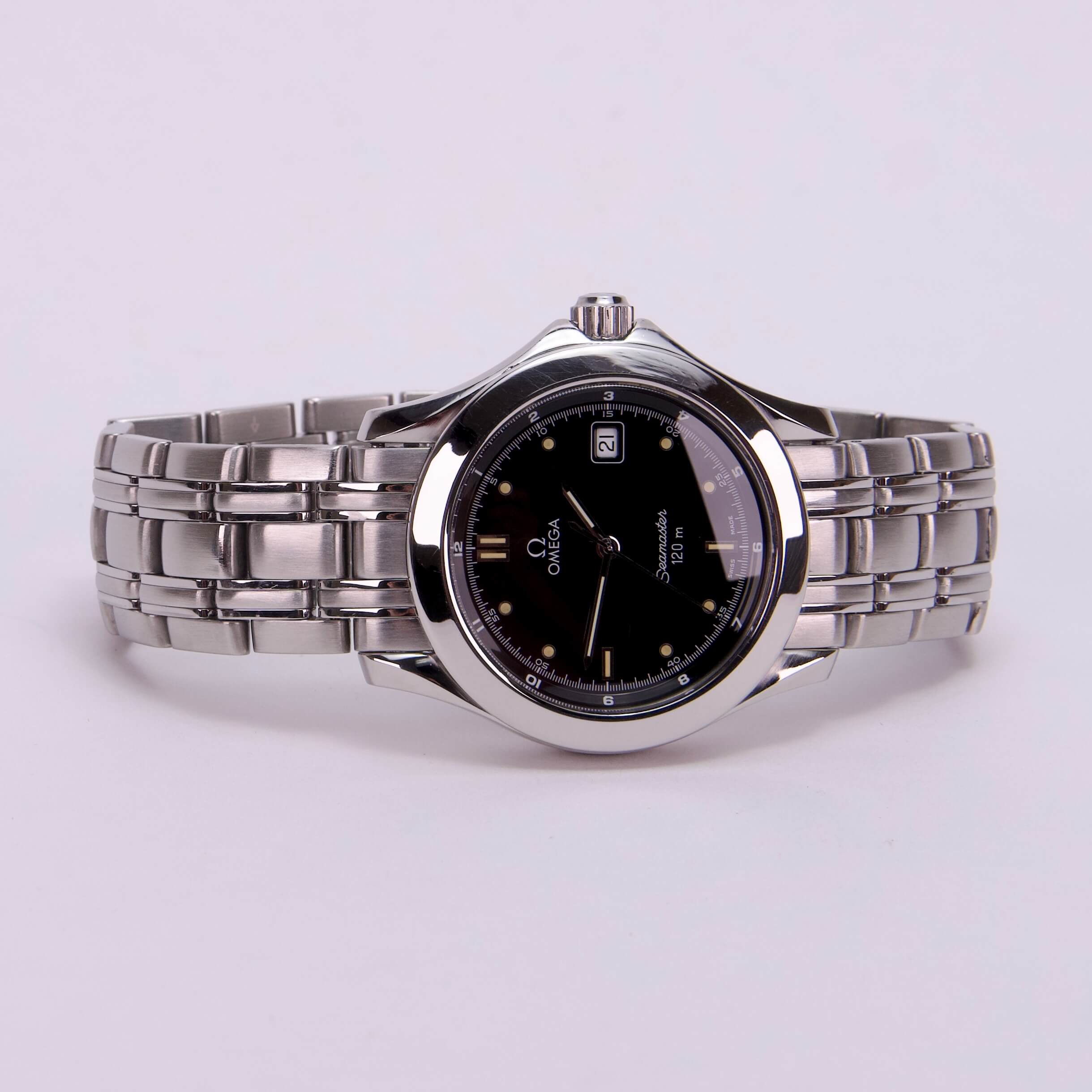 Silver wristwatch with black dial.