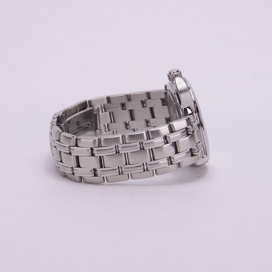 Silver wristwatch with metal link bracelet.