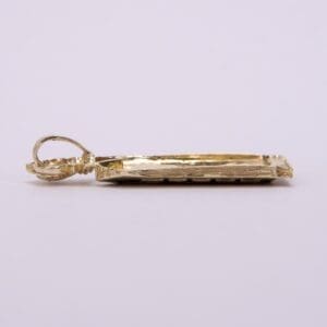 Gold rectangular pendant with loop attachment.