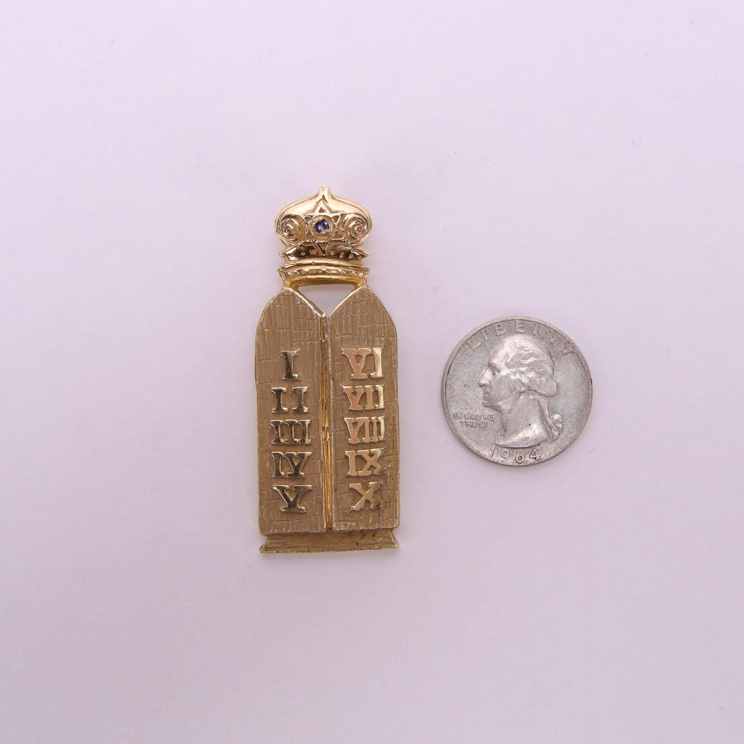 Golden Torah pin with crown, next quarter.