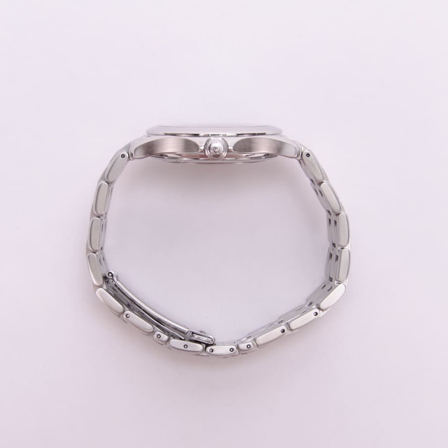 Silver wristwatch with metal bracelet, side view.