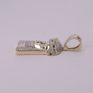 Gold and diamond pharaoh-themed pendant.