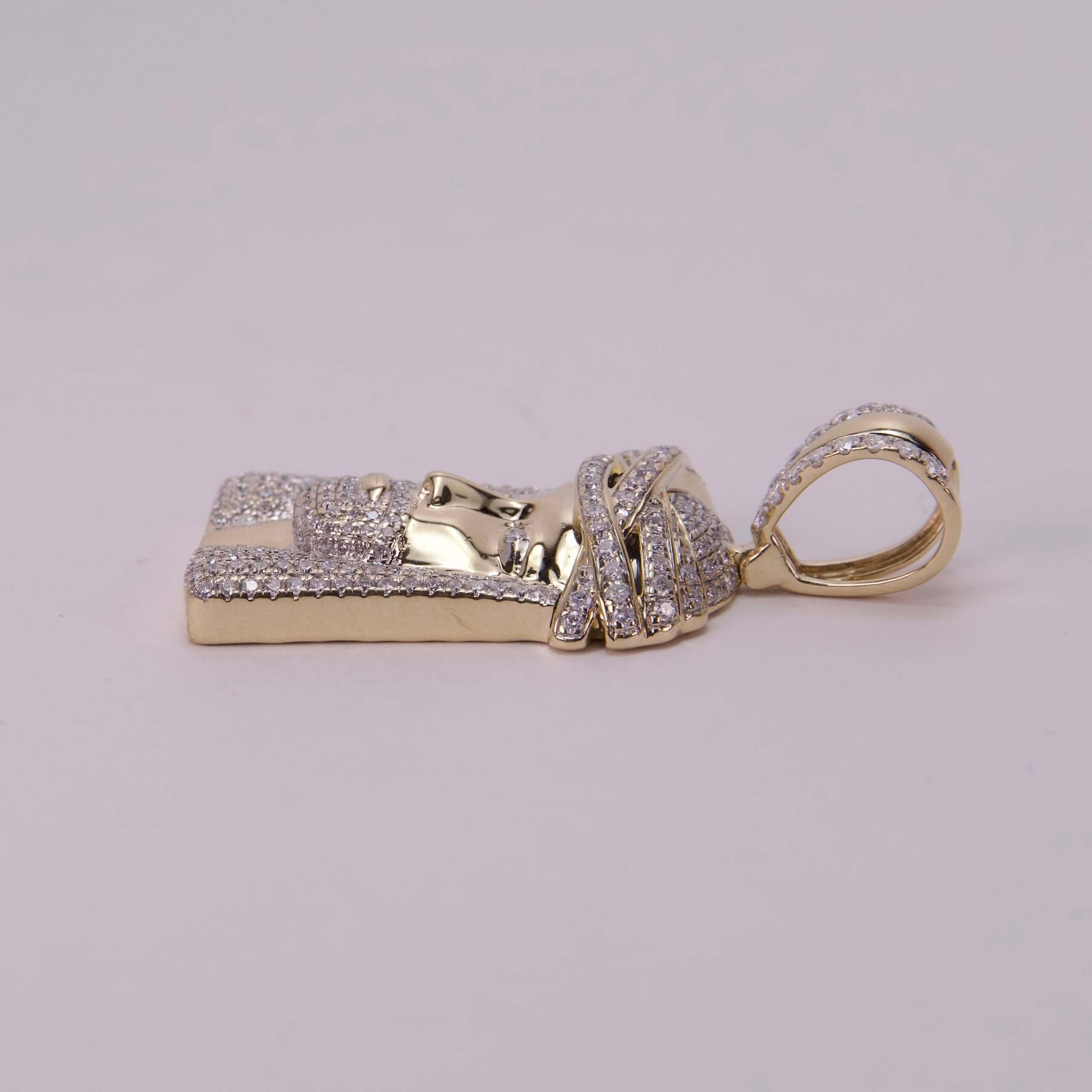 Gold and diamond pharaoh-themed pendant.