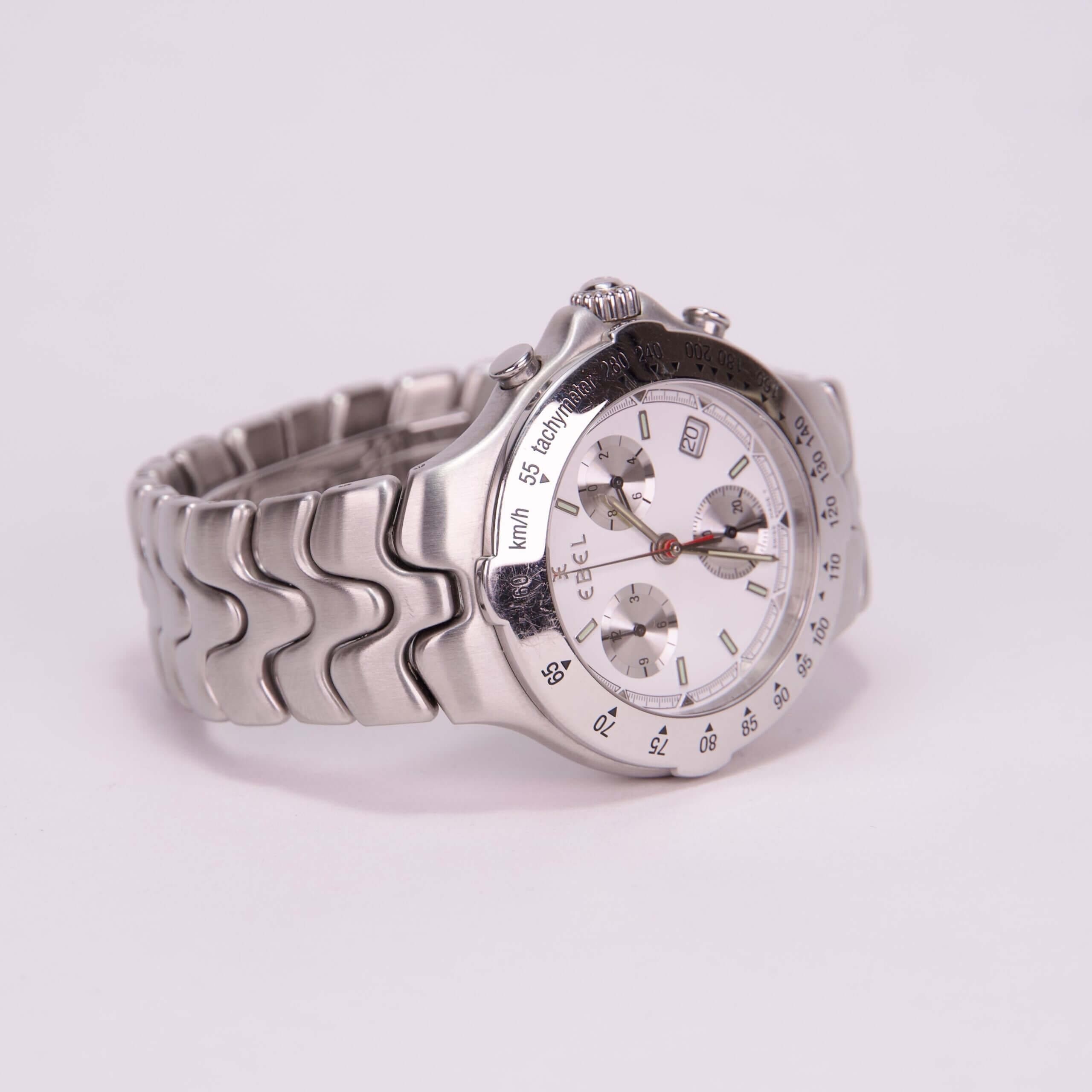 Silver wristwatch with white dial.