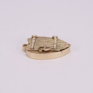 Gold heart-shaped locket on white background.