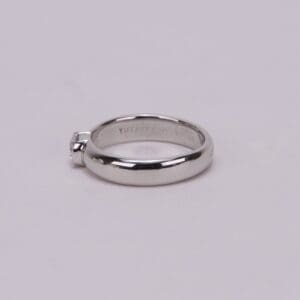 Silver engagement ring with small diamond.