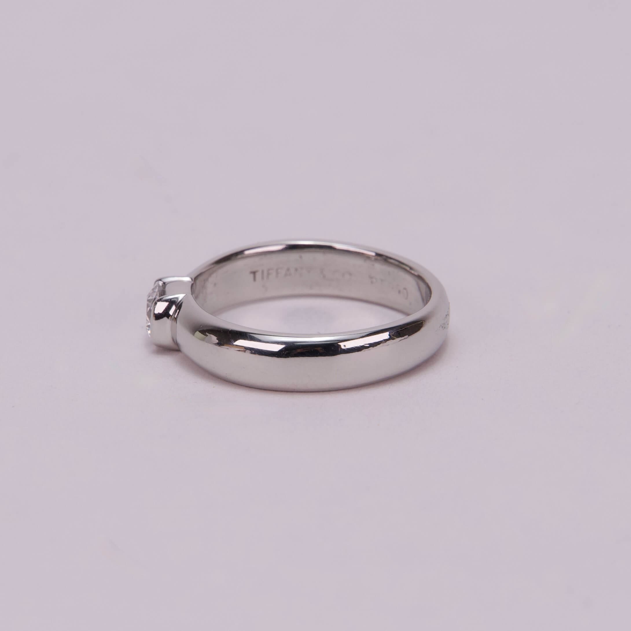 Silver engagement ring with small diamond.