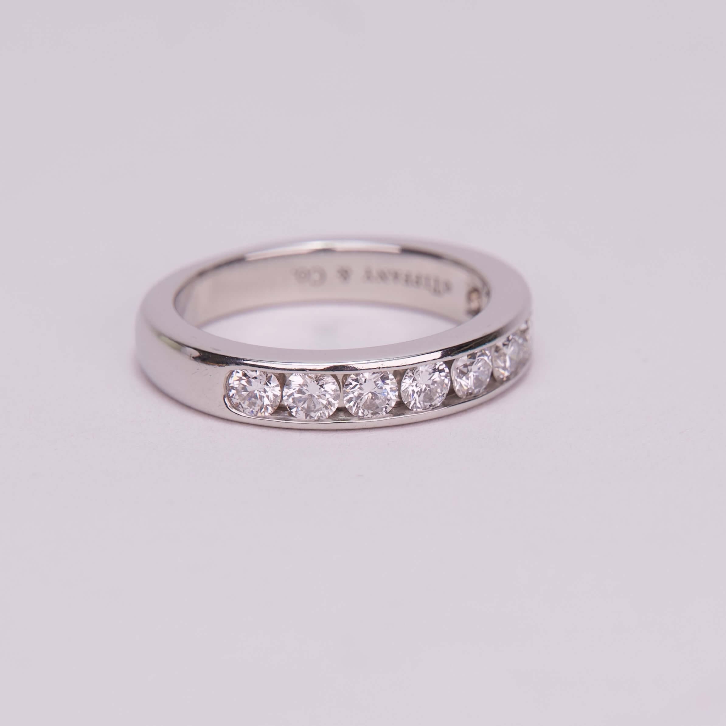 Silver ring with embedded diamonds.