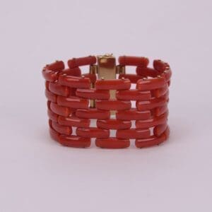 Red beaded bracelet with gold clasp.