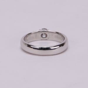 Silver ring with a single diamond.
