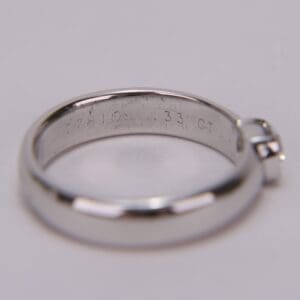 Silver ring with engraved inscription inside.