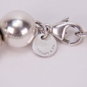 Silver jewelry with Tiffany & Co. tag.