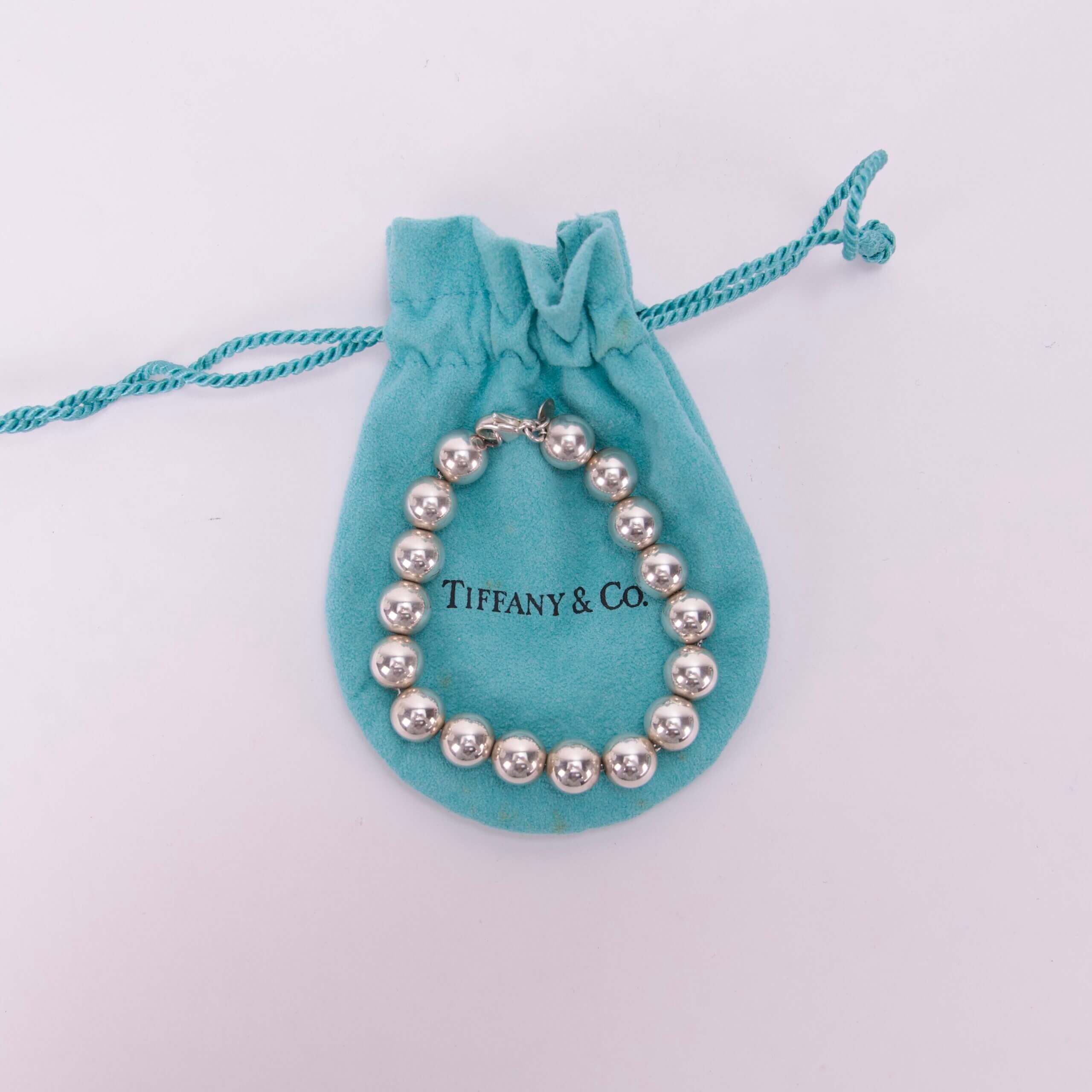 Silver bracelet on blue Tiffany pouch.