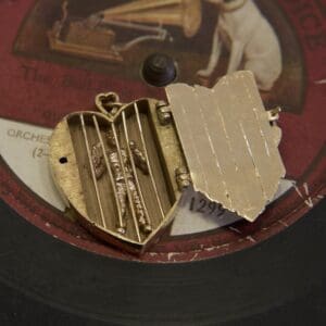 Heart locket on vintage record label.