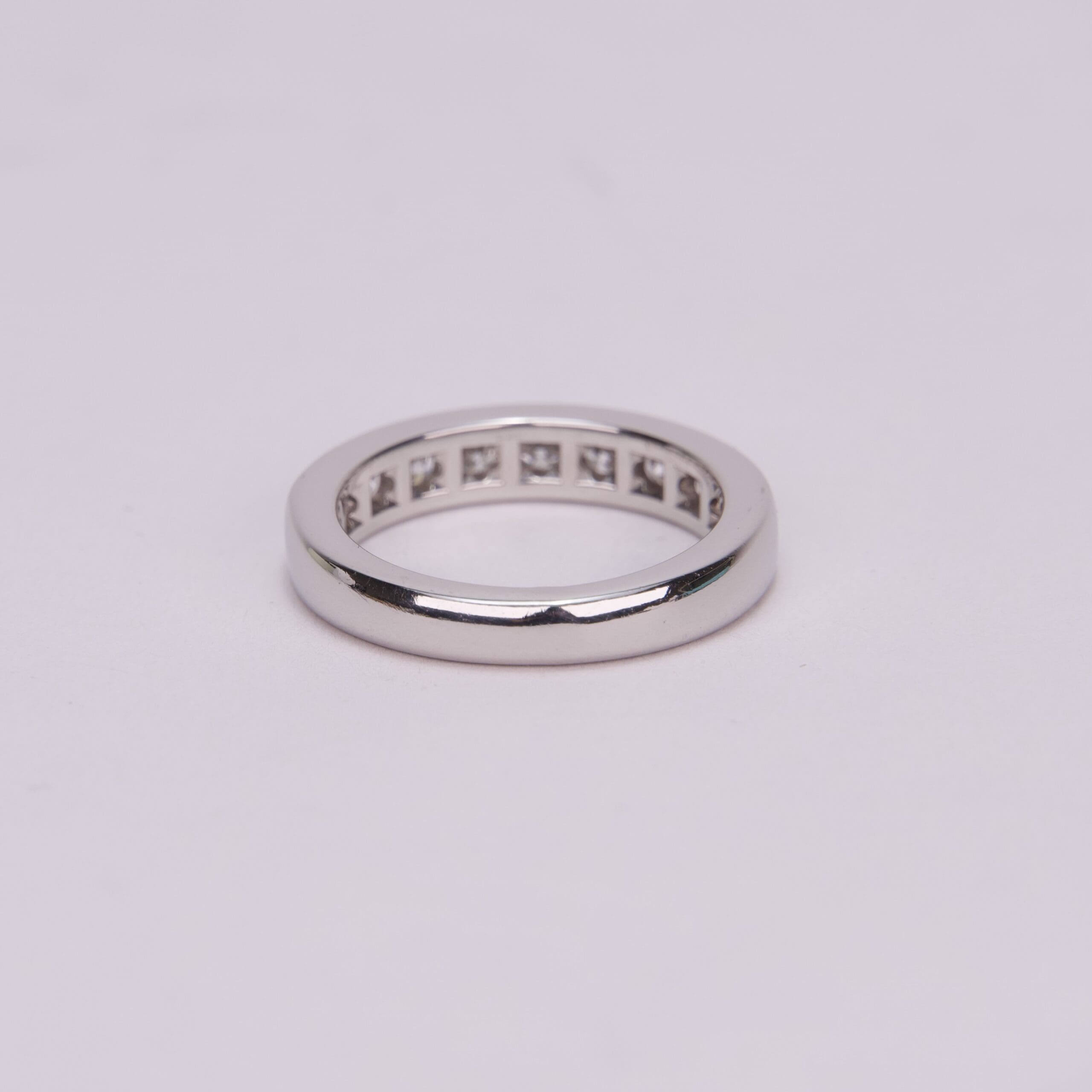 Silver ring on a light background.