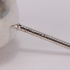 Close-up of engraved metal rod detail.