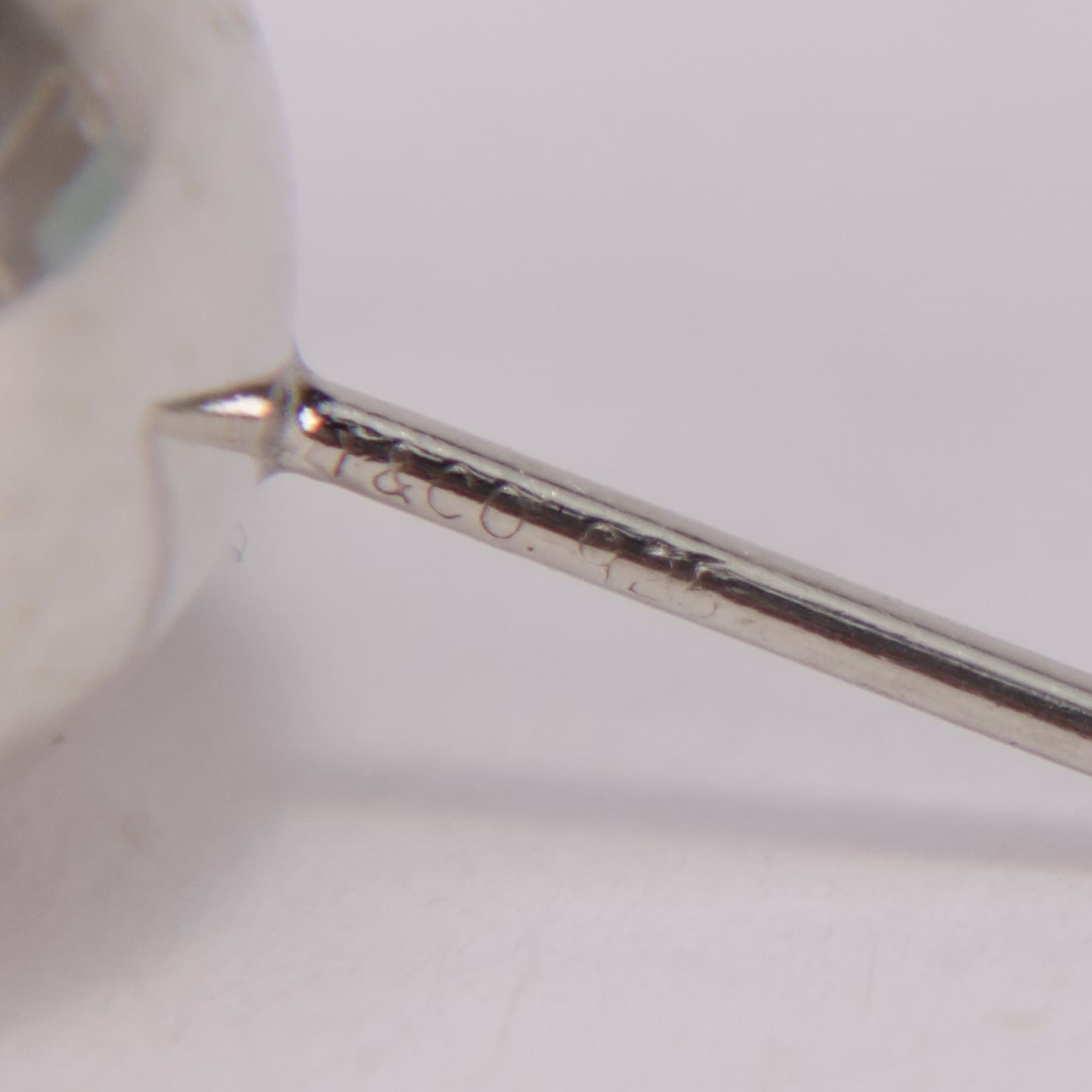 Close-up of engraved metal rod detail.