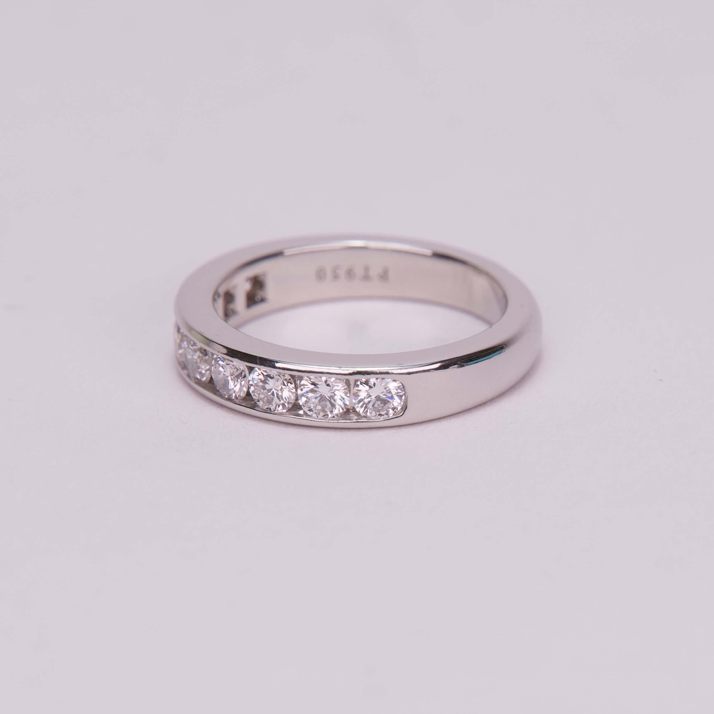 Silver ring with embedded diamonds.