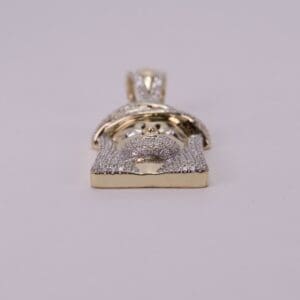 Gold Jesus face pendant with diamonds.