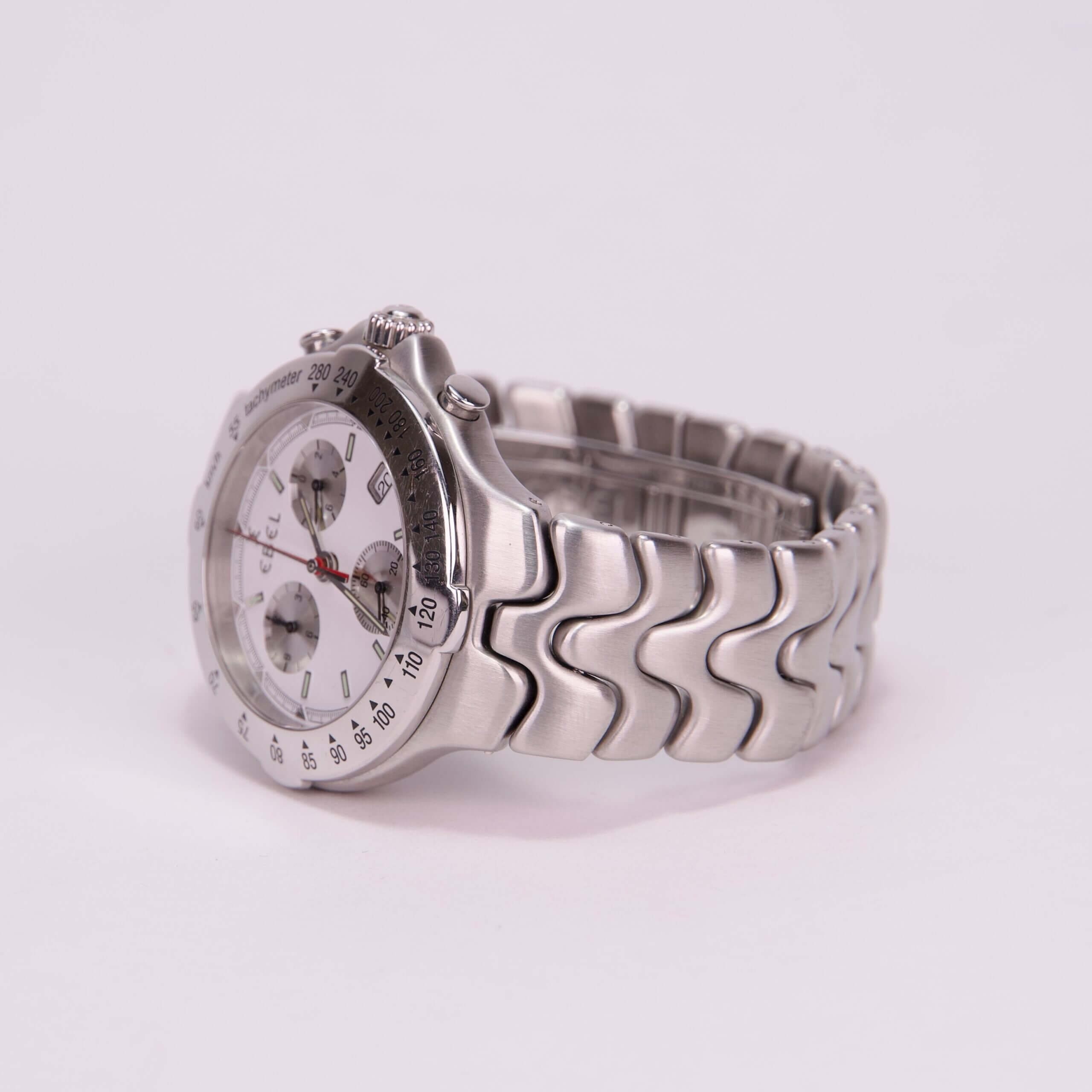Silver chronograph watch with metal bracelet.