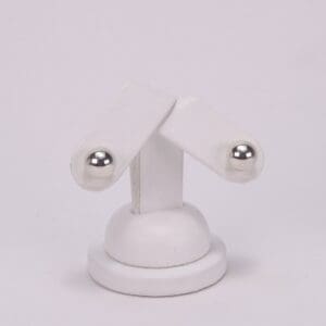 White stand with two adjustable arms.