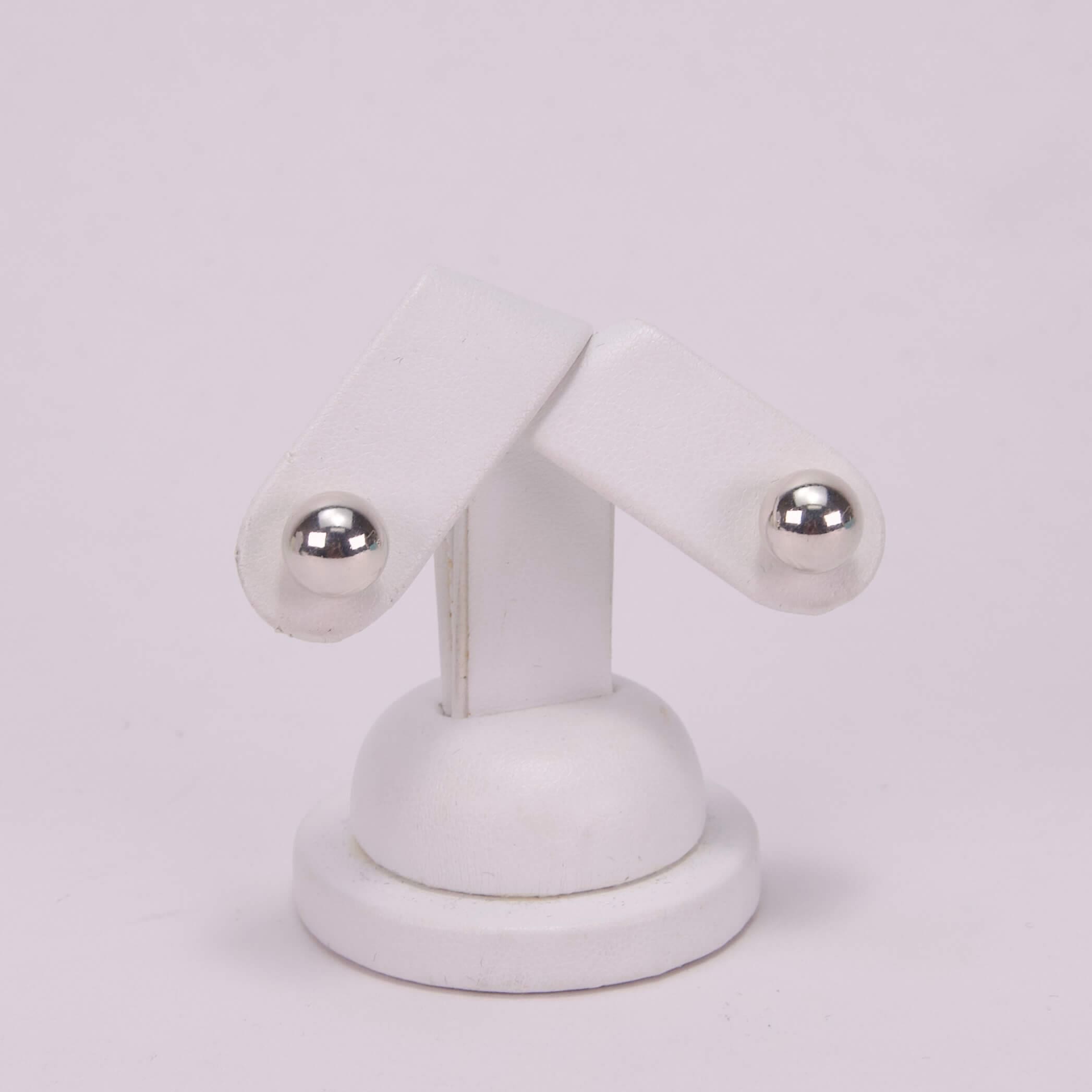 White stand with two adjustable arms.