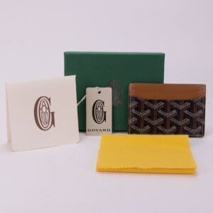 Goyard cardholder with packaging and accessories.