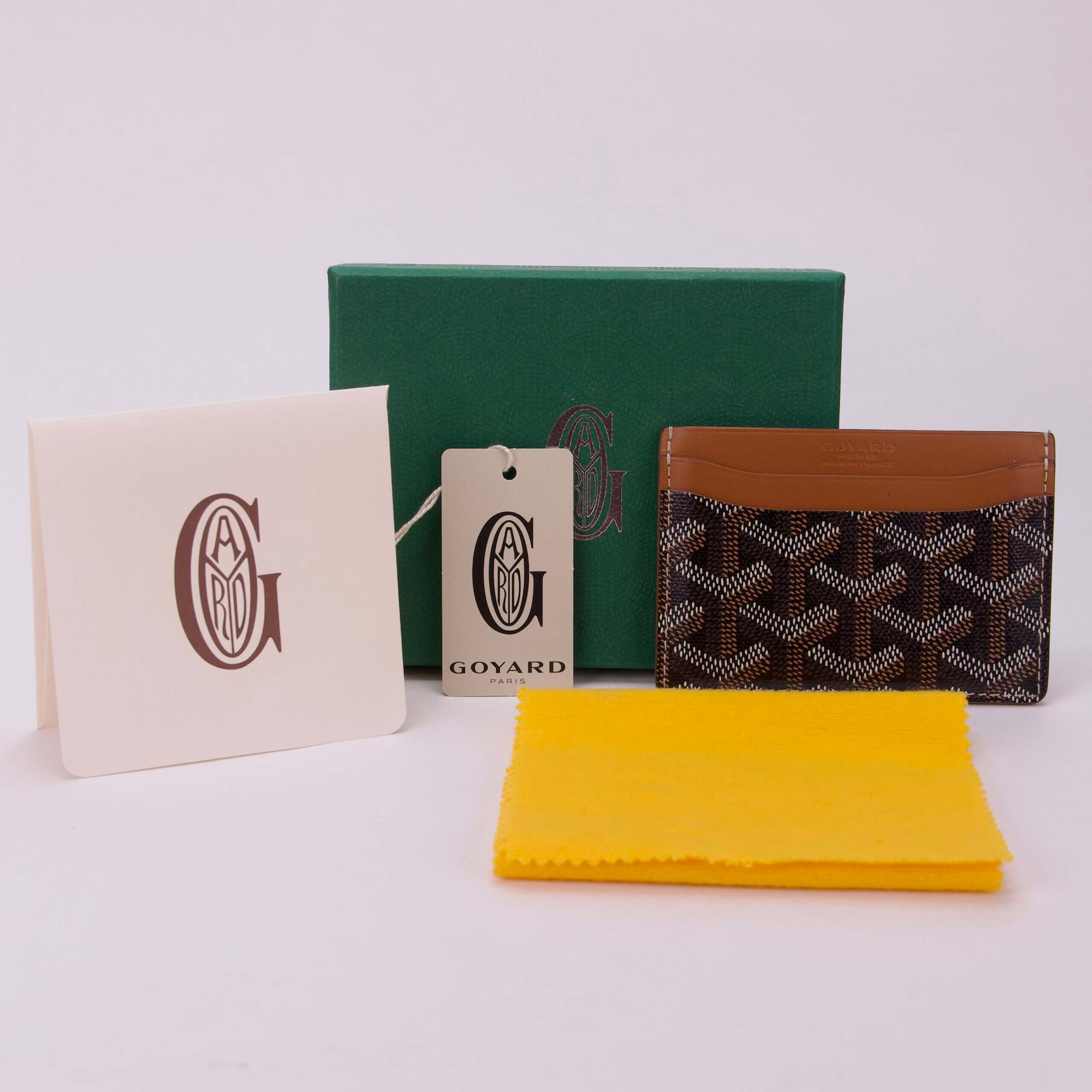 Goyard cardholder with packaging and accessories.