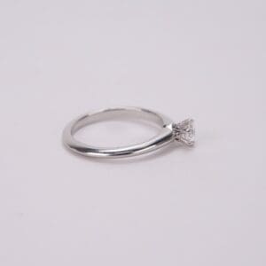 Silver ring with a diamond solitaire setting.