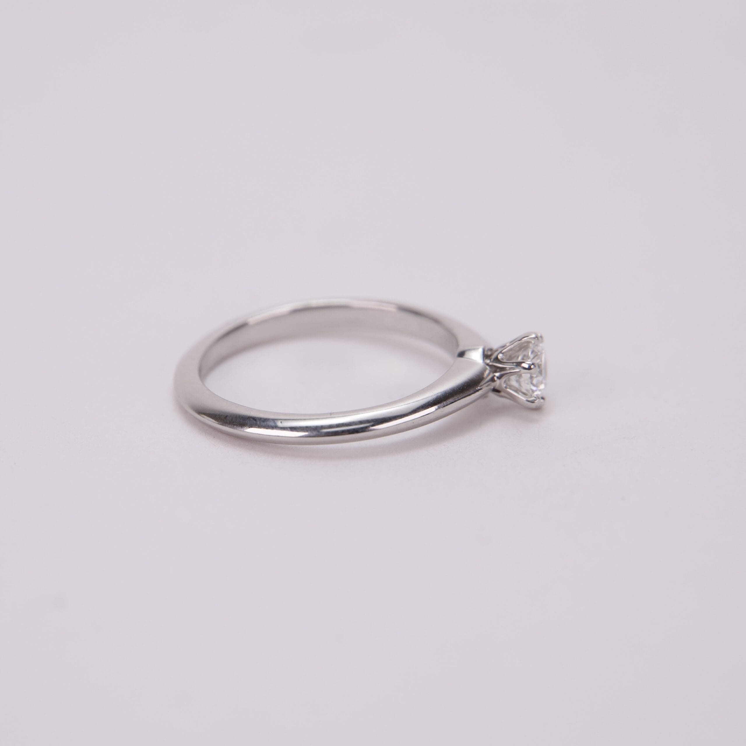 Silver ring with a diamond solitaire setting.