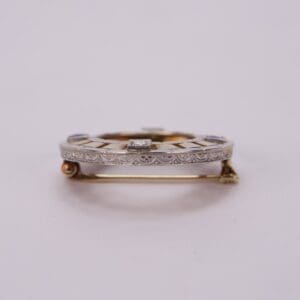 Ornate brooch with intricate geometric design.