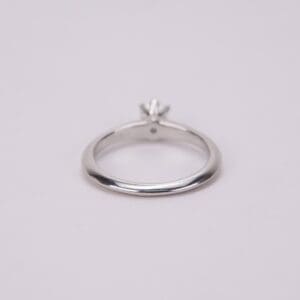 Silver ring with a small gemstone.