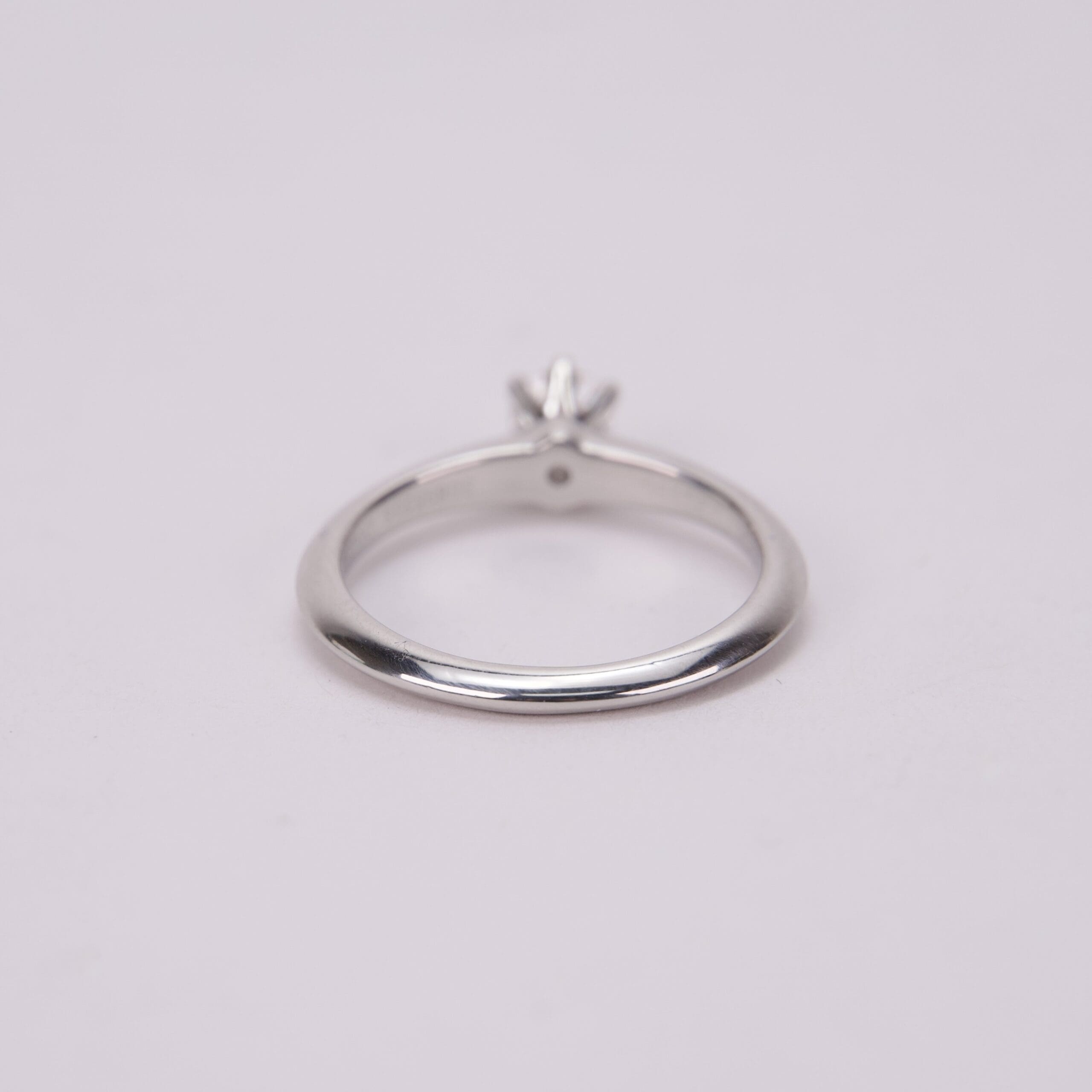Silver ring with a small gemstone.