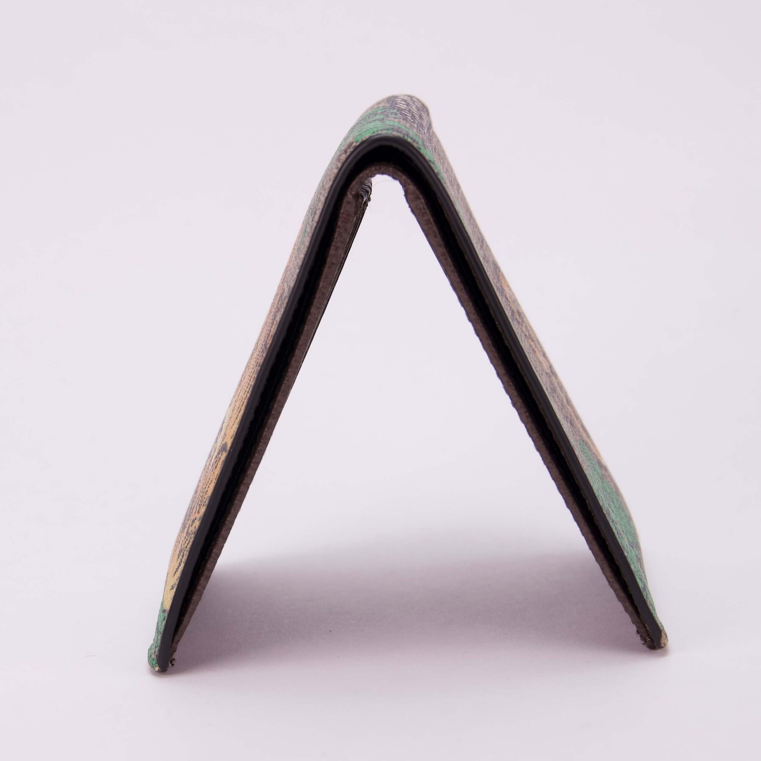Folded skateboard piece on white background.