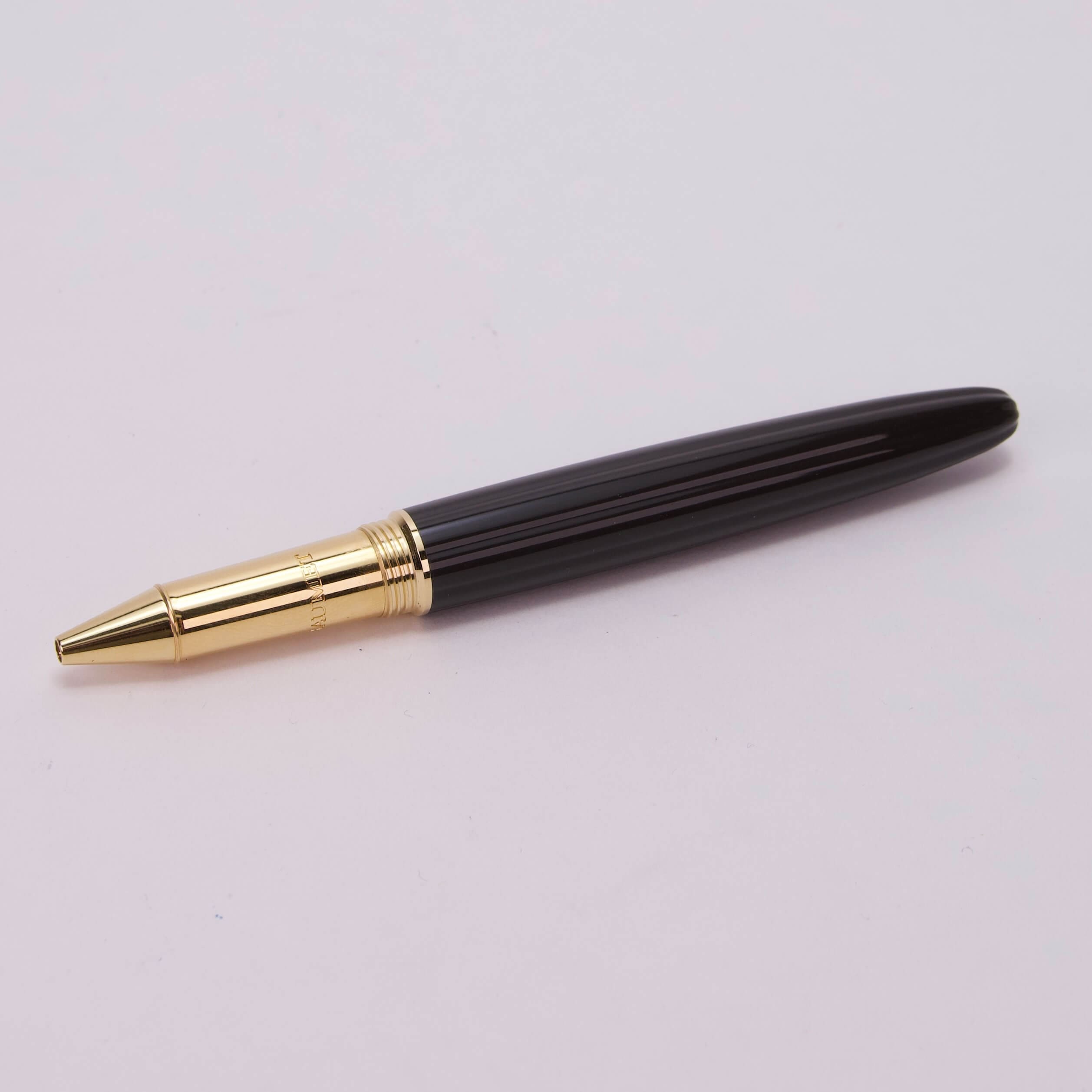 Black and gold luxury ballpoint pen.