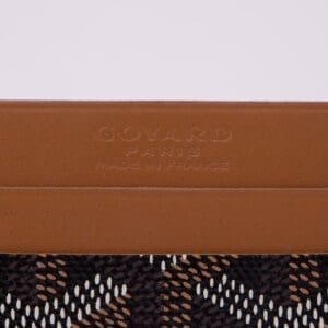 Brown leather with patterned fabric detail.