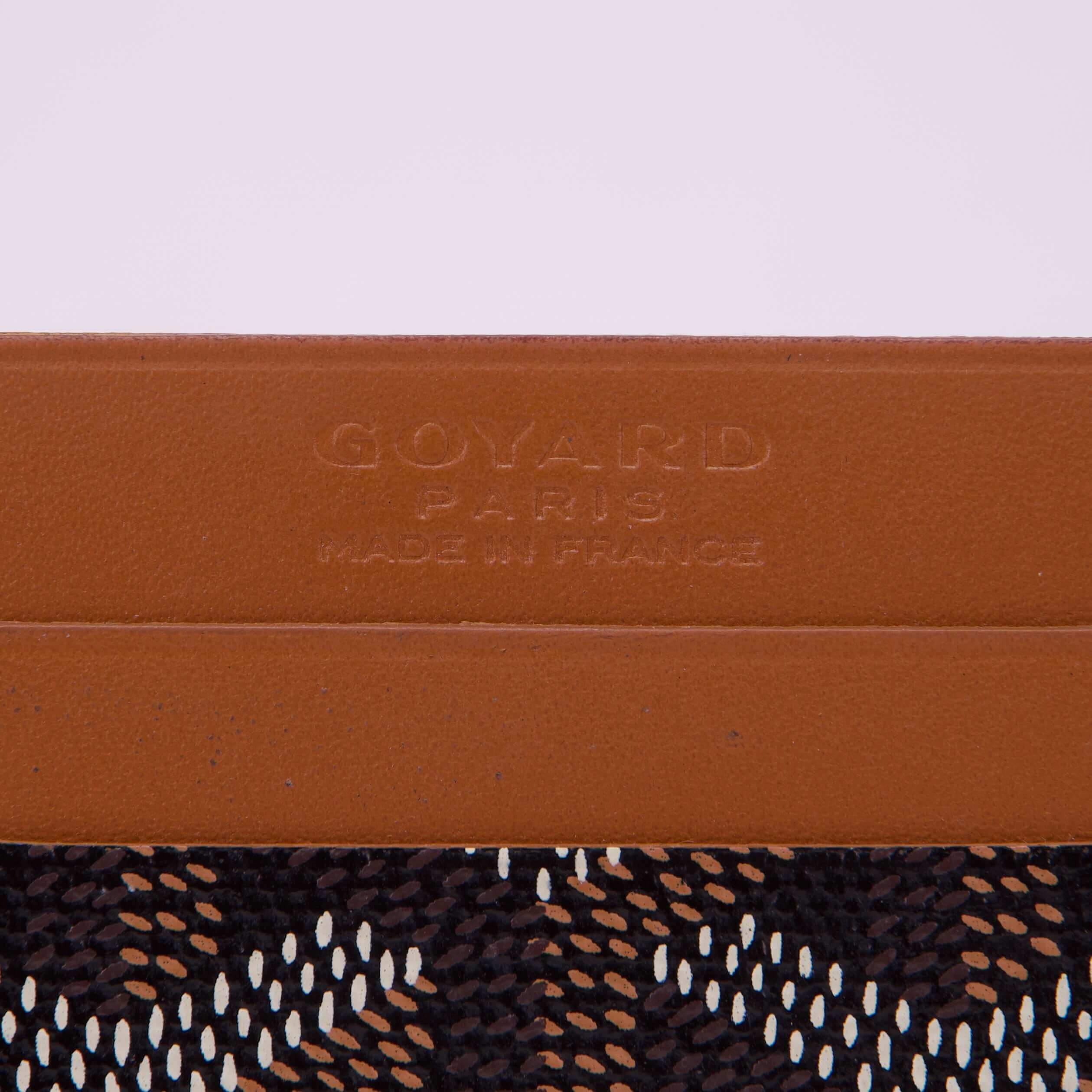Brown leather with patterned fabric detail.