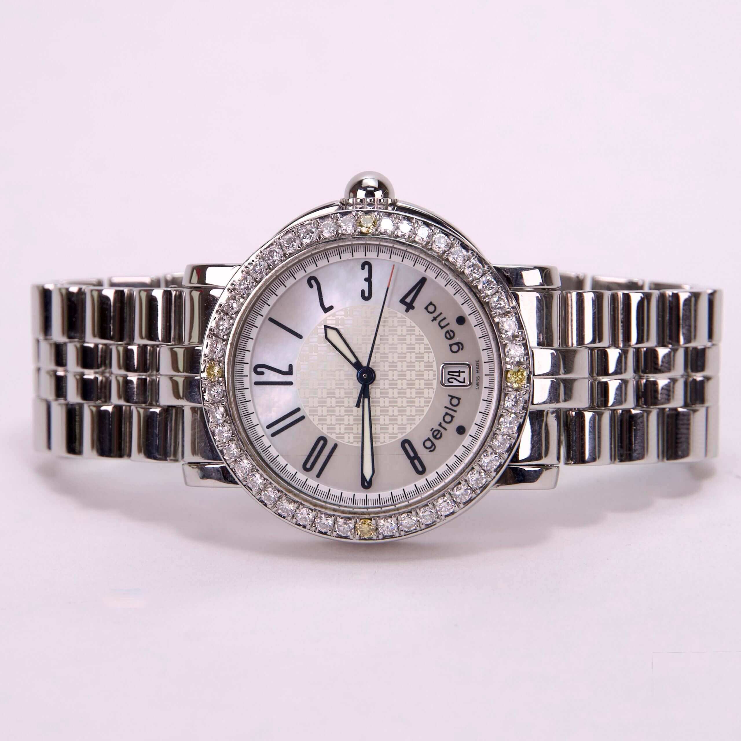 Silver watch with diamond accents and bracelet.
